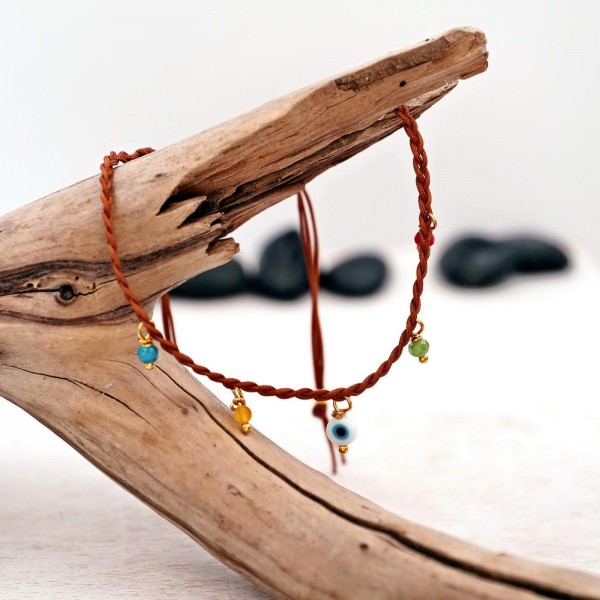 Anklet made of braided cords and beads