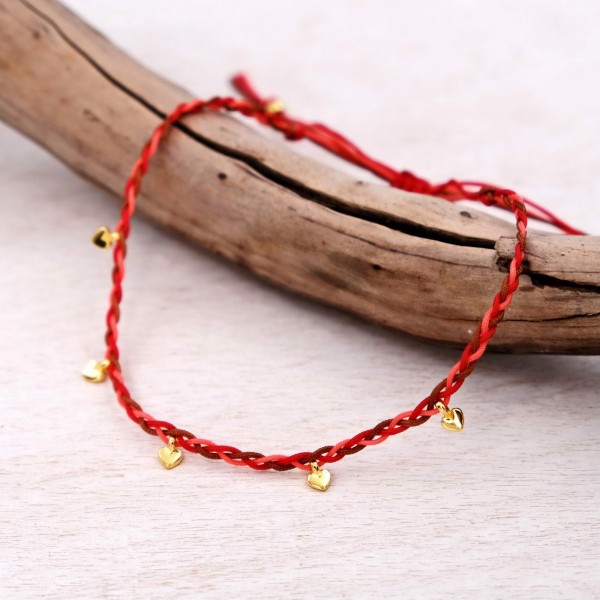 Anklet made of braided cords and gold-plated hearts