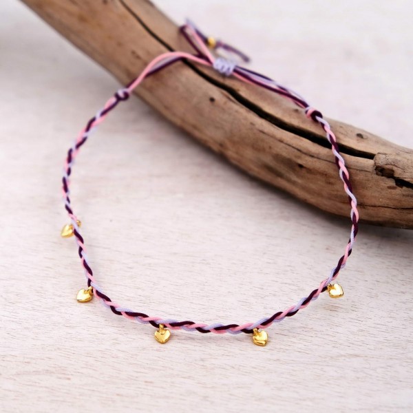 Anklet made of braided cords and gold-plated hearts
