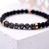 Elastic bracelet for women with metal parts and semiprecious beads