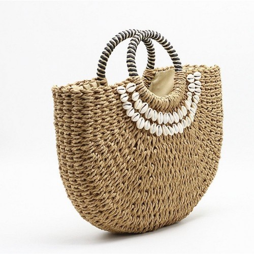Straw handbag with cowrie shells