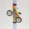 Easter candle for boys with bicycle and surf board