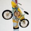 Easter candle for boys with bicycle and surf board