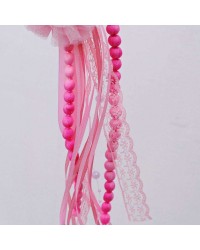Easter candle with wooden fairy and romantic ribbons Easter candle with wooden fairy and romantic ribbons