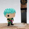 Easter candle with Zoro Funko Pop figure from One Piece Anime
