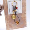 Women's keychain with with birth flower, leather and gold-plated parts