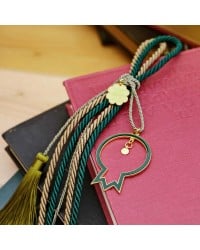 Lucky charm with enamel pomegranate and satin cords Lucky charm with enamel pomegranate and satin cords