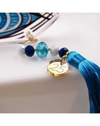 Lucky charm with resin evil eye, crystals and tassel Lucky charm 2025 with resin evil eye, crystals and tassel