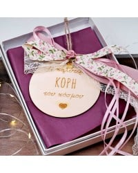 Wooden good luck charm with message for daughter and romantic ribbons Wooden good luck charm with message for daughter in a gift box and romantic ribbons