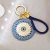 Handmade lucky keyring Evil Eye with meander pattern in a gift box