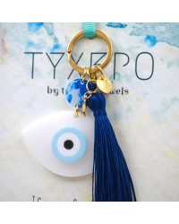 Handmade key-chain with plexiglass evil eye and silk tassel Handmade key-chain with plexiglass evil eye, gold-plated parts and silk tassel
