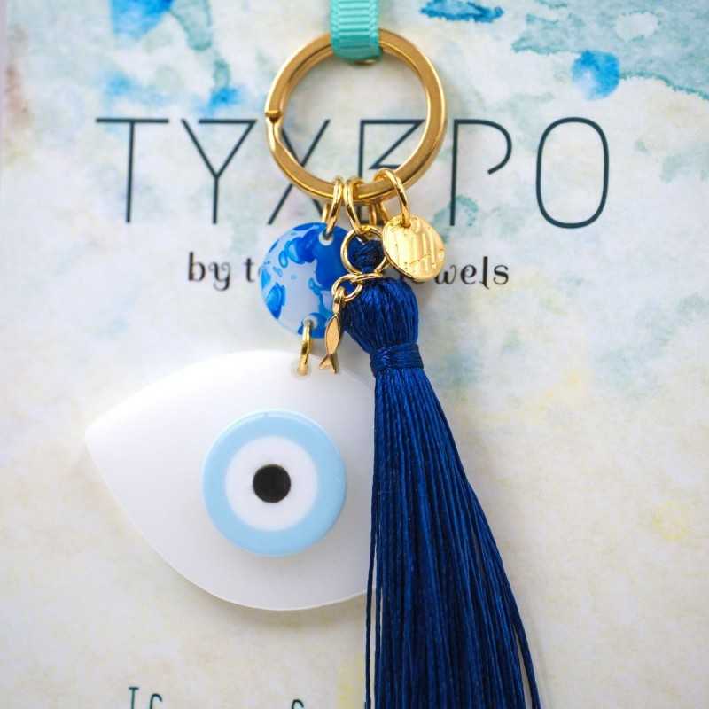 Handmade key-chain with plexiglass evil eye and silk tassel Handmade key-chain with plexiglass evil eye, gold-plated parts and silk tassel