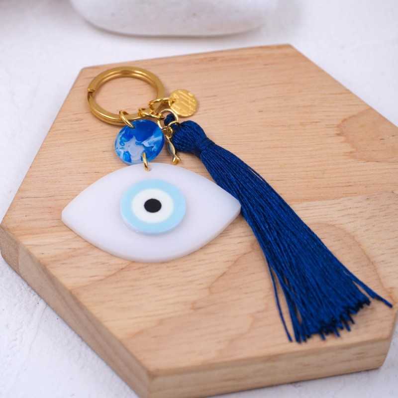 Handmade key-chain with plexiglass evil eye and silk tassel Handmade key-chain with plexiglass evil eye, gold-plated parts and silk tassel