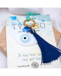 Handmade key-chain with plexiglass evil eye and silk tassel Handmade key-chain with plexiglass evil eye, gold-plated parts and silk tassel
