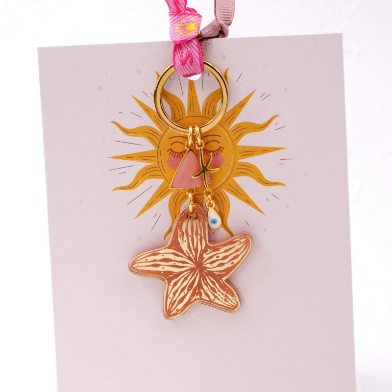 Handmade key-chain with plexiglass starfish and evil eye Handmade key-chain with plexiglass sea shell and evil eye drop