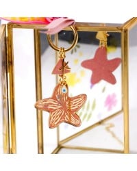 Handmade key-chain with plexiglass starfish and evil eye Handmade key-chain with plexiglass sea shell and evil eye drop
