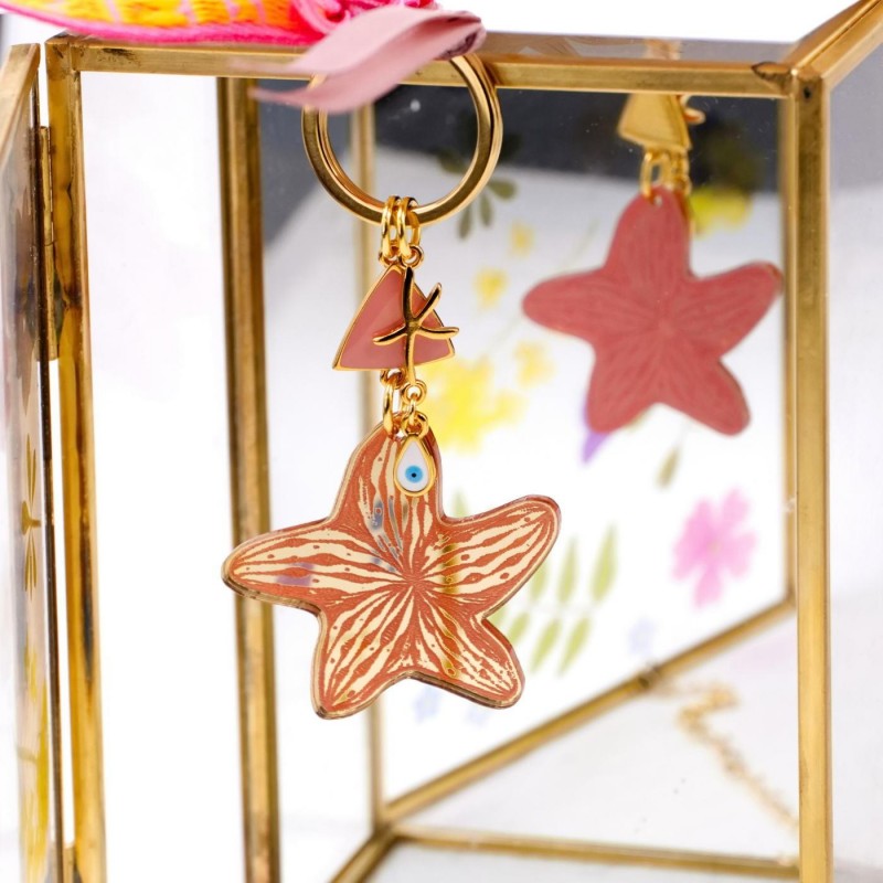 Handmade key-chain with plexiglass starfish and evil eye Handmade key-chain with plexiglass sea shell and evil eye drop