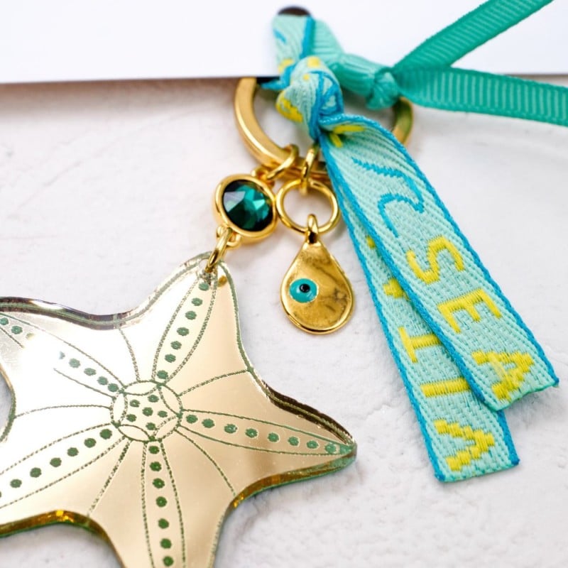 Handmade key-chain with plexiglass starfish and evil eye Handmade key-chain with plexiglass sea shell and evil eye drop