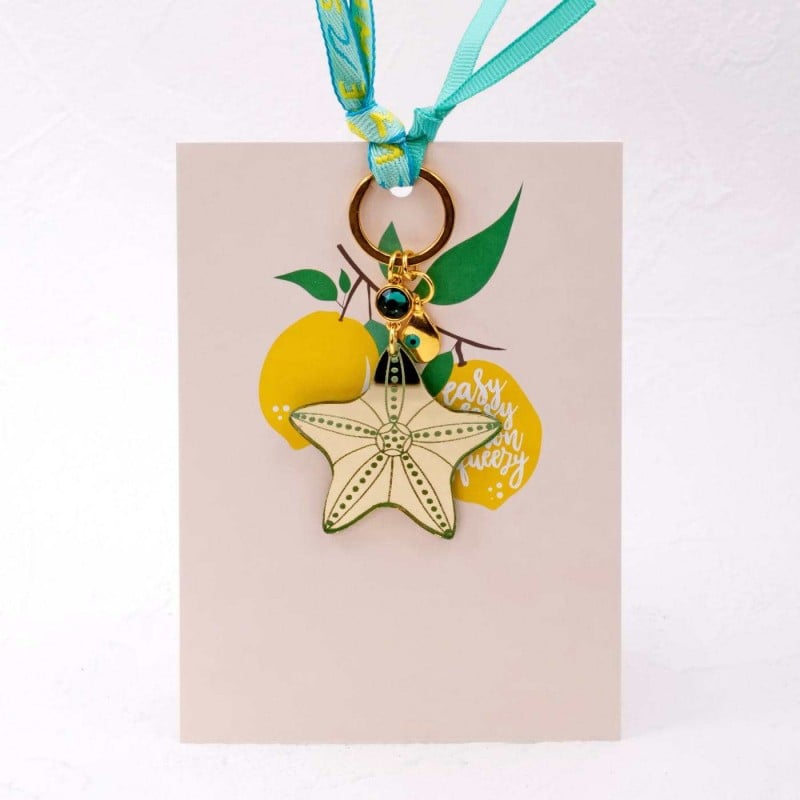 Handmade key-chain with plexiglass starfish and evil eye Handmade key-chain with plexiglass sea shell and evil eye drop