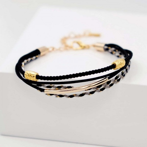 Handmade bracelet made of cotton cords with gold-plated metal parts