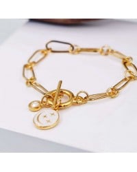 Βραχιόλι αλυσίδα με κρύσταλλο Swarovski Επίχρυσο βραχιόλι αλυσίδα από ανοξείδωτο ατσάλι με σμάλτο και κρύσταλλο Swarovski