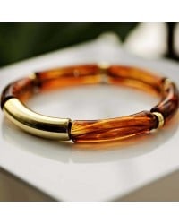Handmade elastic bracelet with resin and gold-plated metal parts Handmade elastic bracelet with resin and gold-plated metal parts