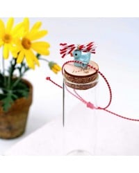 Martaki bracelet with gold-plated parts and decorative bottle Martaki bracelet with gold-plated parts and decorative bottle