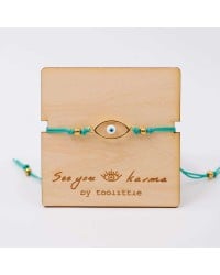 Handmade macrame bracelet with gold-plated enamel eye and wooden card Handmade macrame bracelet with gold-plated enamel eye and wooden card