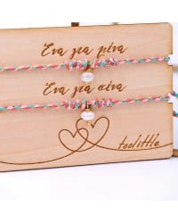 Bracelets with fresh water pearls for mother and daughter on decorative card Bracelets with fresh water pearls for mother and daughter on decorative card