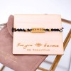 Macrame bracelet with gold-plated parts and decorative card 