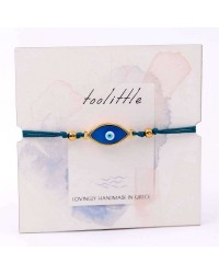 Handmade macrame bracelet with gold-plated enamel eye and decorative card Handmade macrame bracelet with gold-plated enamel eye and decorative card