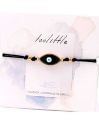 Handmade macrame bracelet with gold-plated enamel eye and decorative card Handmade macrame bracelet with gold-plated enamel eye and decorative card