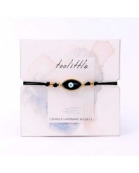 Handmade macrame bracelet with gold-plated enamel eye and decorative card Handmade macrame bracelet with gold-plated enamel eye and decorative card