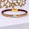 Leather bracelet with gold-plated parts and high quality enamel