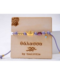 Golden Boat Macrame Bracelet Handmade macrame bracelet with gold-plated boat and enamelled evil eye