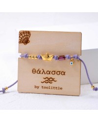 Golden Boat Macrame Bracelet Handmade macrame bracelet with gold-plated boat and enamelled evil eye