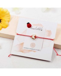 Butterfly March Bracelet March bracelet made of red-white cord with enamel butterfly
