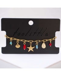 Chain bracelet with sea elements and evil eye Handmade bracelet made of chain with gold-plated metal parts