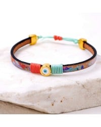 Leather bracelet with enamel evil eye Leather bracelet with enamel evil eye and metal parts in gold-plating