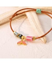 Macrame bracelet with gold-plated enamelled metal Tail Fish Handmade macrame bracelet with gold-plated enamelled metal Tail Fish