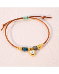 Macrame bracelet with gold-plated enamelled metal heart Handmade macrame bracelet with gold-plated enamelled metal heart