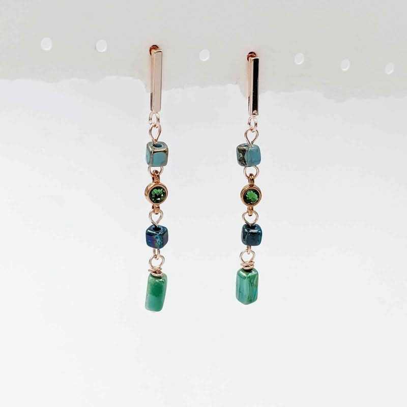 Earrings with Swarovski crystals and ceramic cubes in rose gold-plating 