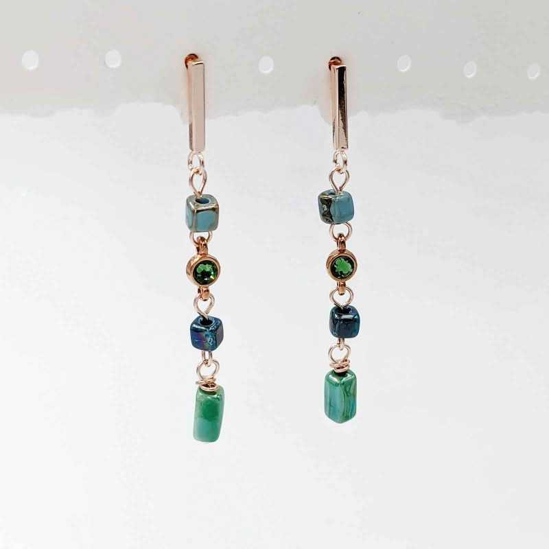 Earrings with Swarovski crystals and ceramic cubes in rose gold-plating 