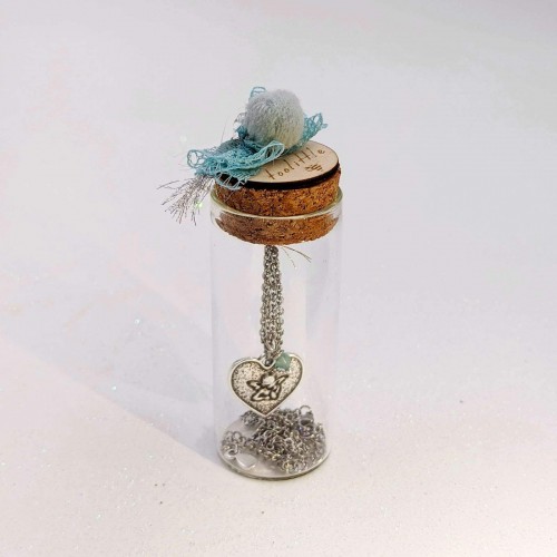 Short silver-plated necklace with heart in a glass tube