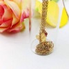 Short Martis heart necklace in a glass tube