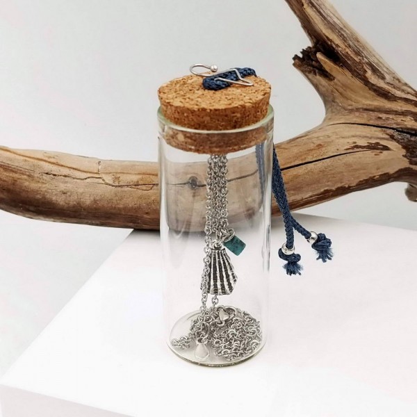 Short necklace with silver-plated parts in a glass tube