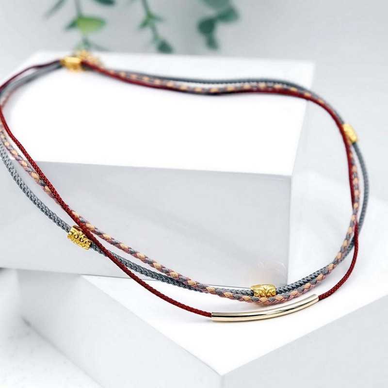 Κολιέ από βαμβακερά κορδόνια και επίχρυσα στοιχεία 