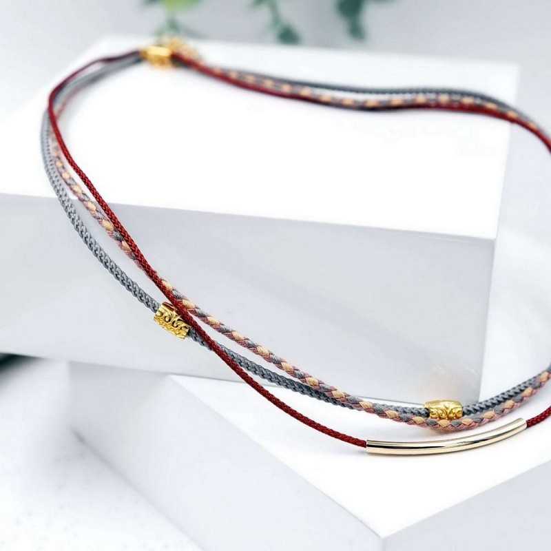 Κολιέ από βαμβακερά κορδόνια και επίχρυσα στοιχεία 