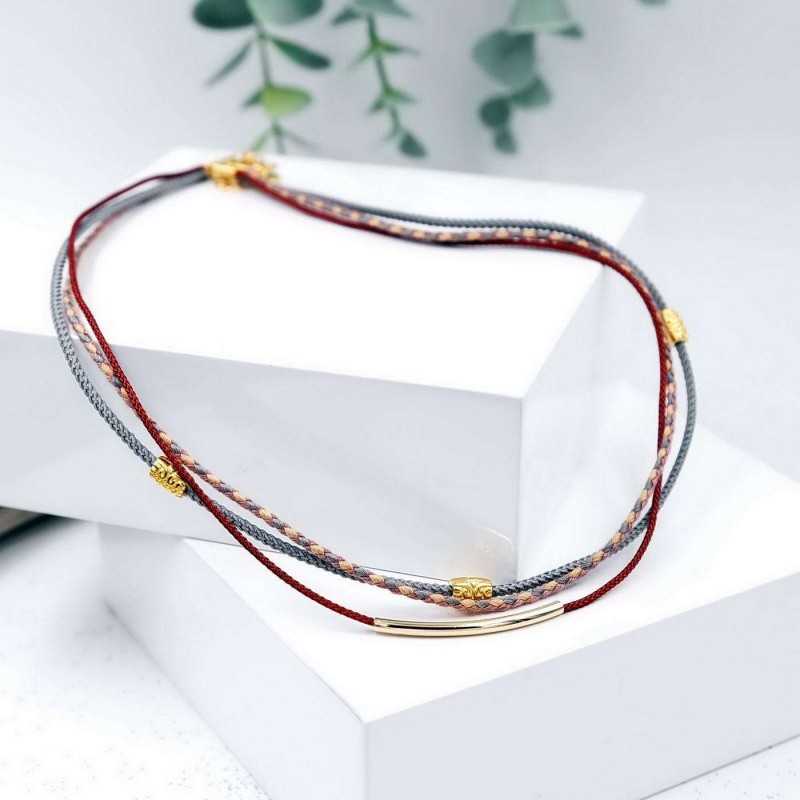 Κολιέ από βαμβακερά κορδόνια και επίχρυσα στοιχεία 