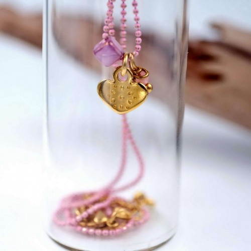 Short gold-plated necklace with heart in a glass bottle